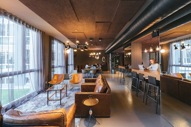the common area of a coworking space filled with golden light